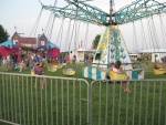 children enjoy swings at the weyrs cave lawn party.JPG